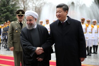 Chinese President Xi Jinping, right, shakes hands with Iranian President Hassan Rouhani in an official arrival ceremony, at the Saadabad Palace in Tehran, Iran, Saturday, Jan. 23, 2016. (AP Photo/Ebrahim Noroozi)