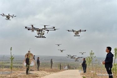 Farmers using drones to spray pesticide, monitor crops etc.